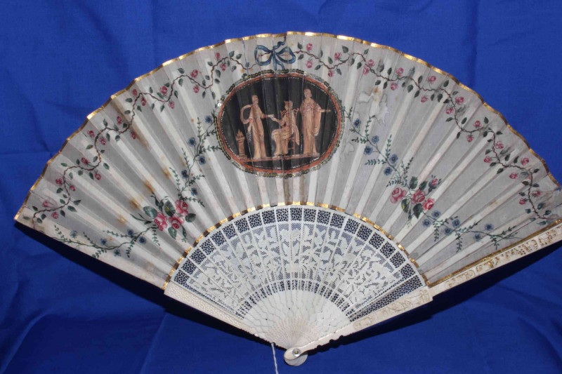 Two antique ivory fans, both painted with panels and foliage.