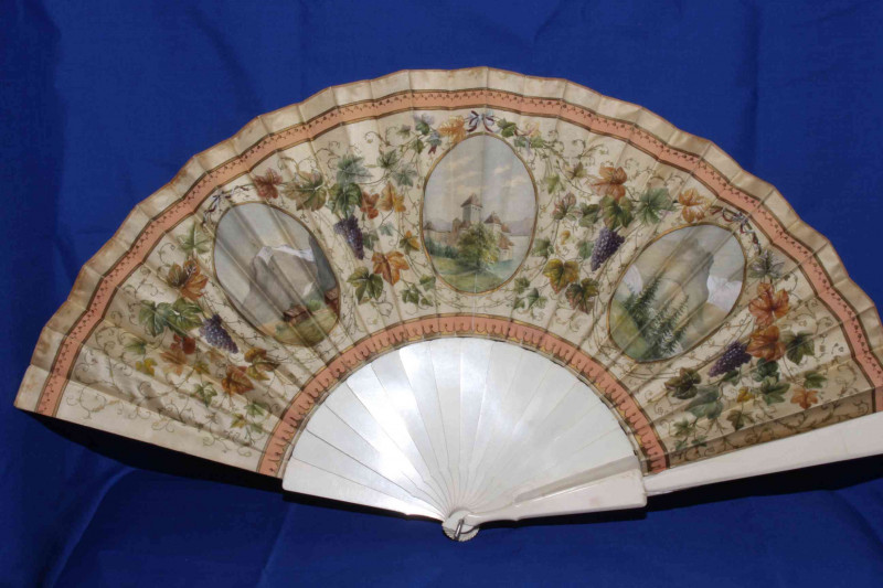 Two antique ivory fans, both painted with panels and foliage.