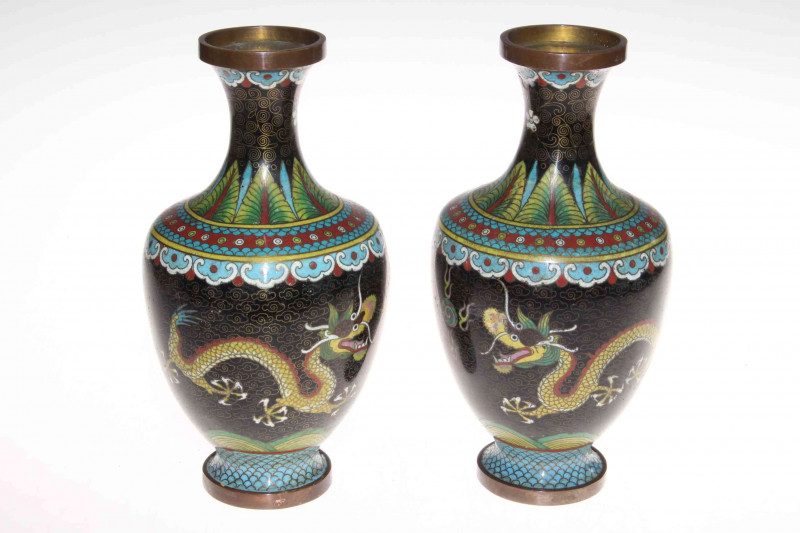 Collection of Chinese pieces comprising two prunus ginger jars, blue and white sauce boat, two jugs and vase, polychrome tea caddy and cup, pair cloisonne vases and two wood stands (12).