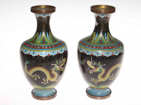 Collection of Chinese pieces comprising two prunus ginger jars, blue and white sauce boat, two jugs and vase, polychrome tea caddy and cup, pair cloisonne vases and two wood stands (12). thumbnail