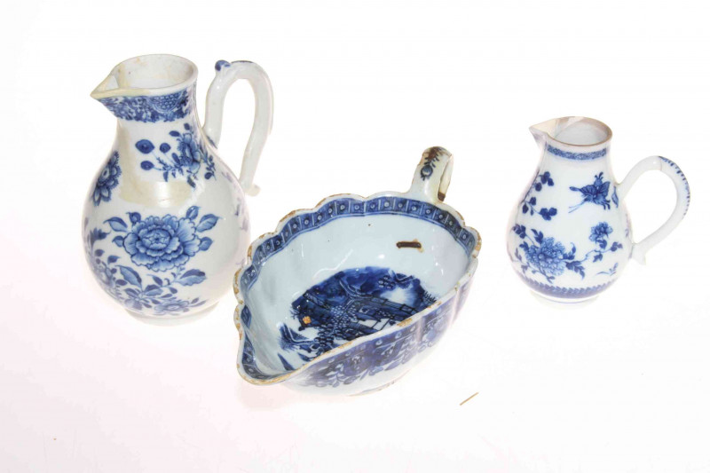 Collection of Chinese pieces comprising two prunus ginger jars, blue and white sauce boat, two jugs and vase, polychrome tea caddy and cup, pair cloisonne vases and two wood stands (12).