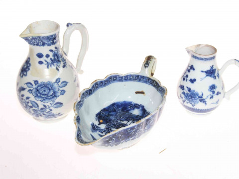 Collection of Chinese pieces comprising two prunus ginger jars, blue and white sauce boat, two jugs and vase, polychrome tea caddy and cup, pair cloisonne vases and two wood stands (12). thumbnail