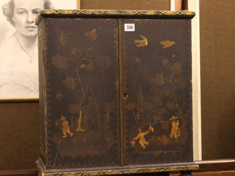 Oriental chinoiserie painted table cabinet having two doors enclosing two short and four long drawers, 56cm by 48cm. thumbnail