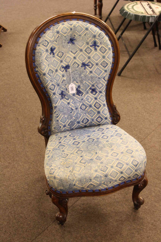 Victorian mahogany spoon back nursing chair and arched back open armchair.