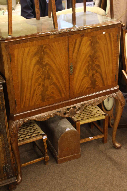 Oak three door sideboard and mahogany two door cocktail cabinet.