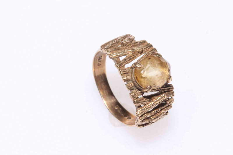 Three 9 carat gold rings.