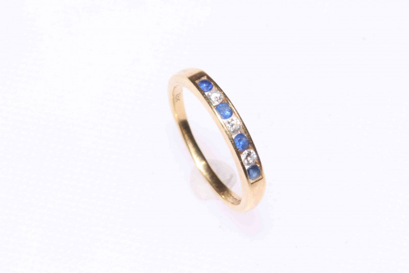 18 carat gold, sapphire and diamond seven stone ring.