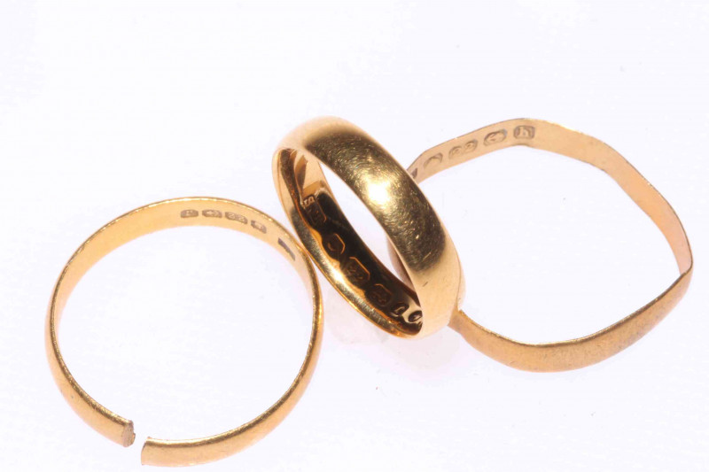 Three 22 carat gold rings (two cut).