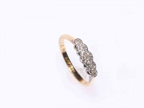 18 carat gold and five stone diamond ring.