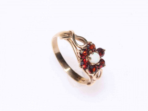 9 carat gold, opal and garnet cluster ring.