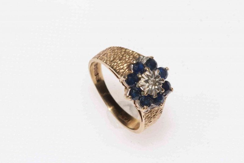 9 carat gold, sapphire and diamond ring.