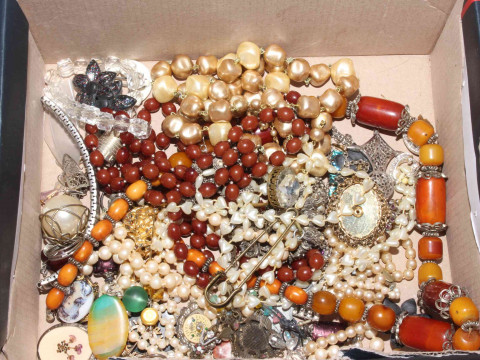 Box of jewellery, mostly necklaces.