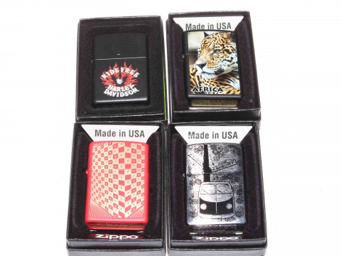 Four boxed Zippo lighters, as new.