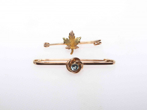 19 carat gold maple lead brooch and other.