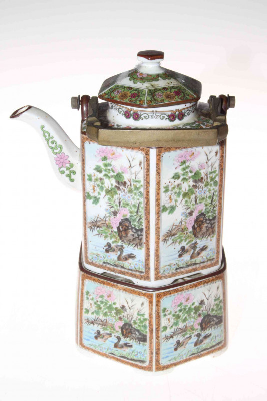 Ornate Chinese teapot and stand.