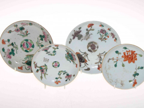Four antique Chinese polychrome saucer dishes.