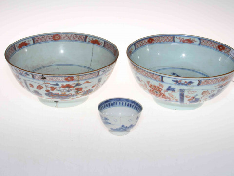 Two antique Chinese blue and iron red bowls and a tea bowl (3).