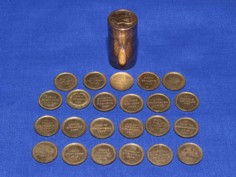Small cylindrical lidded case of medallions listing the Duke of Wellington...