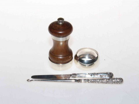 Silver mounted pepper mill, serviette ring, button hook and knife.