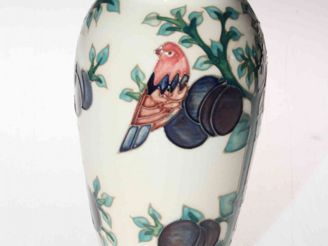 Moorcroft vase depicting tree and bird, 20cm.