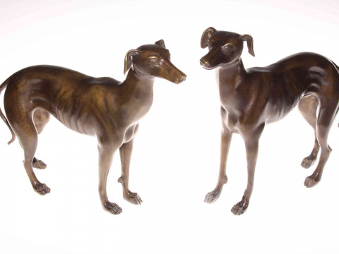 Pair of bronzed models of greyhounds.