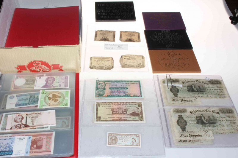 Collection of banknotes including five Backhouse - Stockton Five Pound 1895 (one has been stamped Whitby on the reverse side), French Revolution 1792 and 1793, Hong Kong, album of worldwide uncirculated banknotes, together with four presentation coin sets