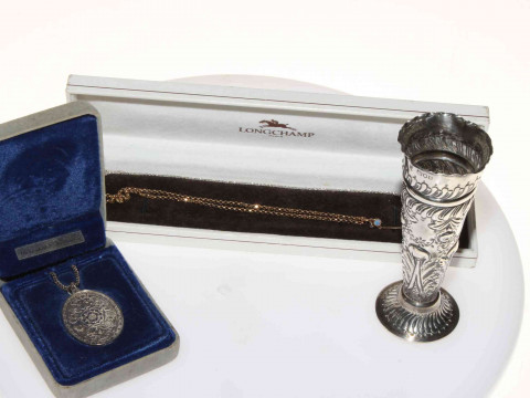 Jewellery comprising two opal pendants, two 9 carat gold gem set rings, silver pendant, along with silver spill vase (6). thumbnail