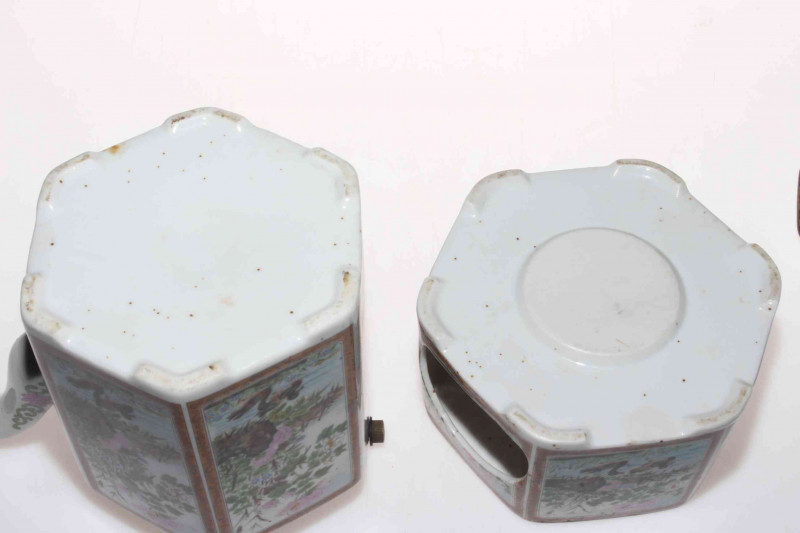 Ornate Chinese teapot and stand.