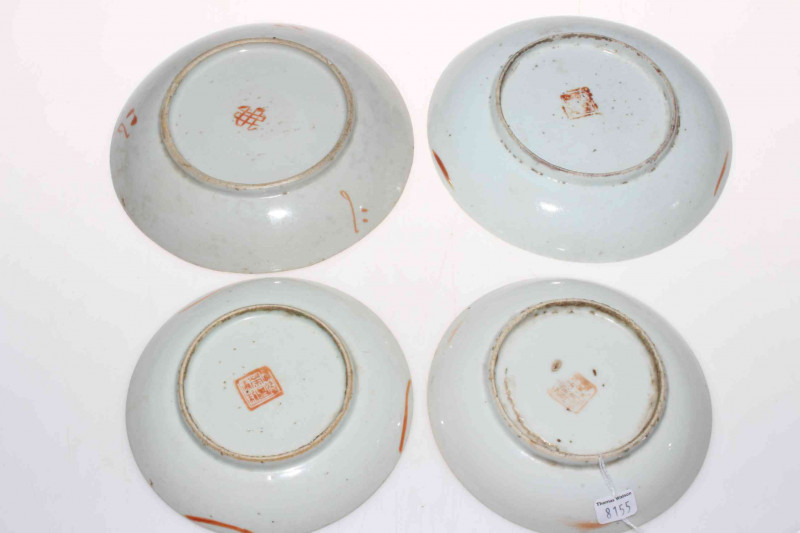 Four antique Chinese polychrome saucer dishes.