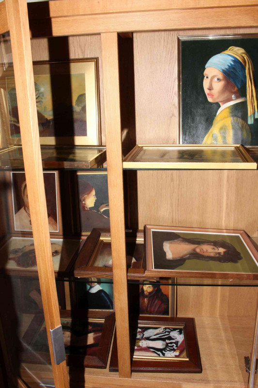 Large collection of framed oil paintings and prints.