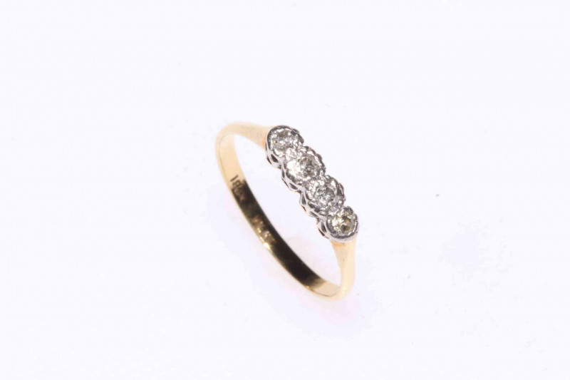 Four stone diamond ring set in 18 carat gold and platinum, size N.