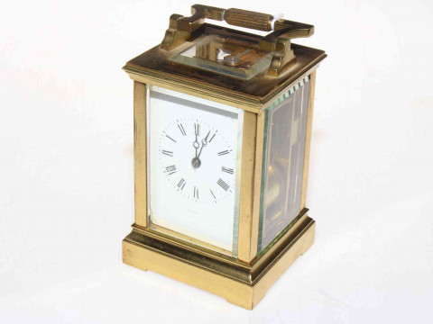 Gilt brass carriage clock with striking movement.