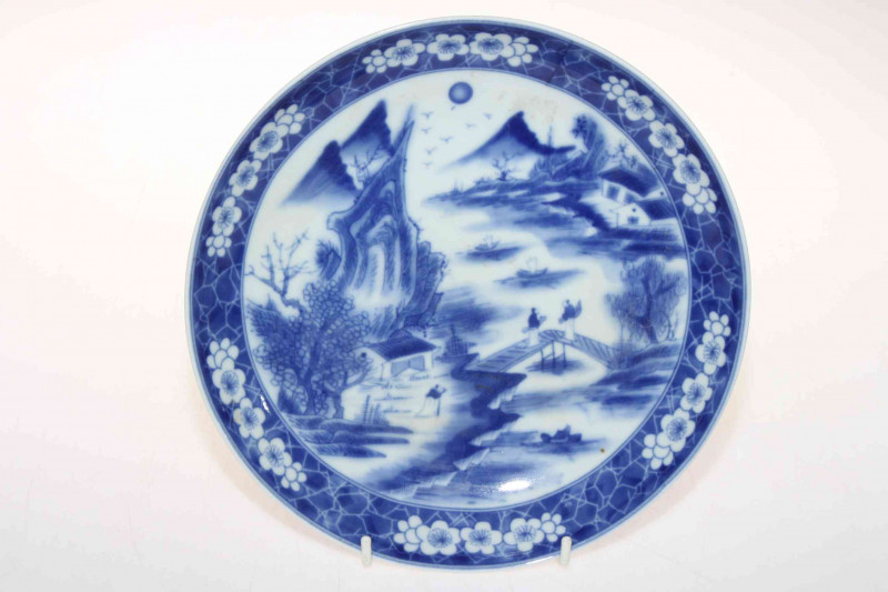 Antique Chinese blue and white saucer dish with figures on a bridge, six character mark, 22.5cm diameter.