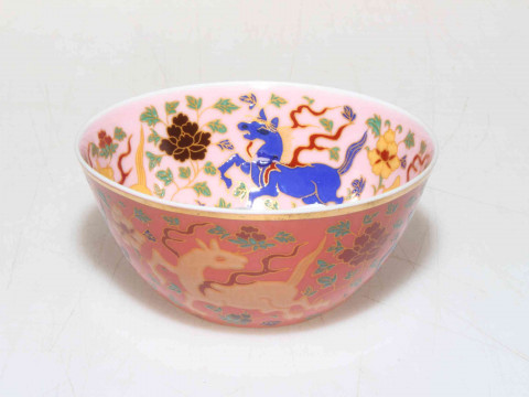 Chinese fine porcelain tea bowl decorated with prancing horses.