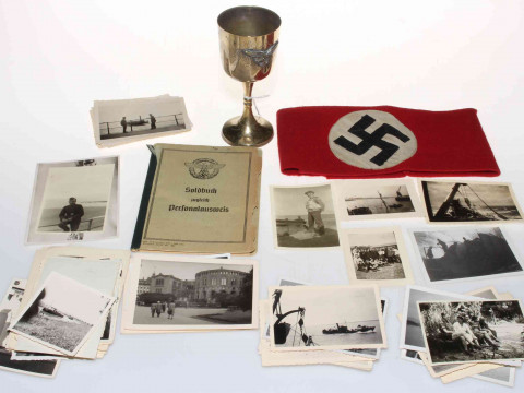German military items being armband, goblet, ID book and photographs.