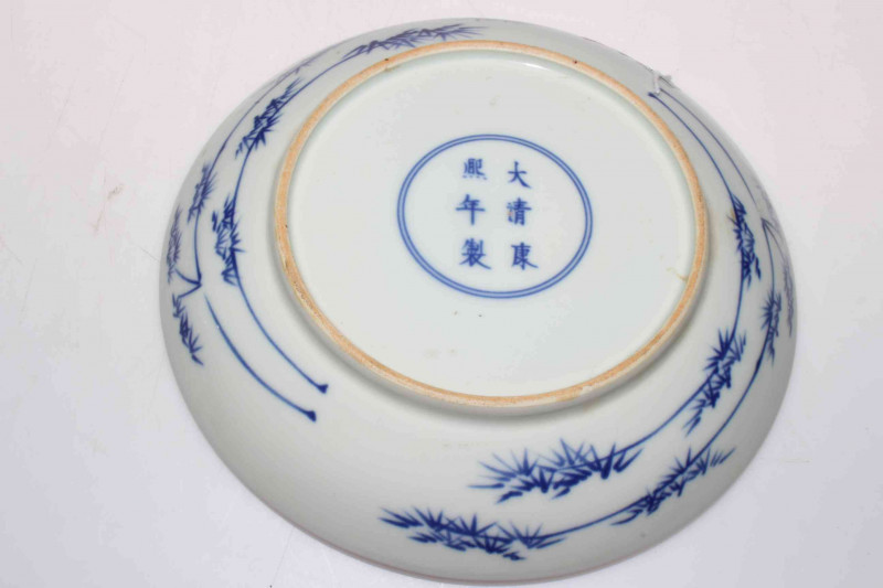 Antique Chinese blue and white saucer dish with figures on a bridge, six character mark, 22.5cm diameter.