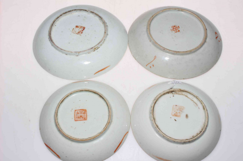 Four Chinese polychrome saucer dishes.