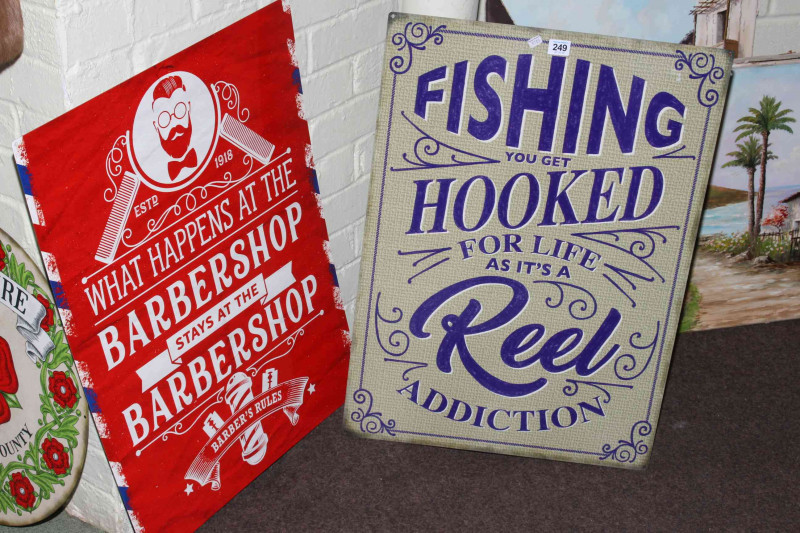 Two signs, Fishing and Barber Shop.