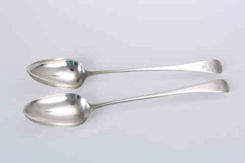 A George III silver gravy spoon, George Wintle, London 1794, Old English pattern, engraved with a floral spray; together with another George III silver gravy spoon, George Smith & William Fearn, London 1796, Old English pattern, engraved with a monogram. 