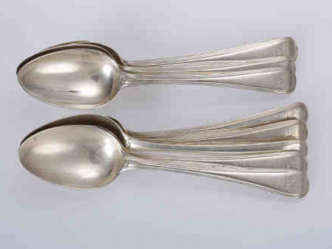 A matched set of nine George III silver dessert spoons, Old English Thread...