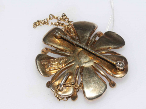 David Anderson silver gilt and enamel pendant/brooch designed by Karl Jorgen Otteren, the flower farm with shaded colour petals and black stamens, with chain, 4.8cm across, marked verso. thumbnail