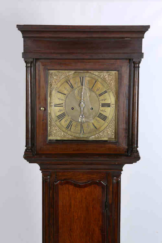 Fieldhouse, Leominster, an oak cased eight day longcase clock, 18th century, the 12'' square brass dial with date aperture and subsidiary seconds, the hood with moulded cornice above free standing columns, the case with crossbanded door flanked by quarter