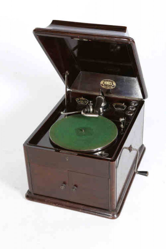 A rare Hines walnut cased tabletop gramophone, early 20th century, with Scottish Gramophone Manufacturing Co trade label, 0.37m by 0.42m by 0.55m