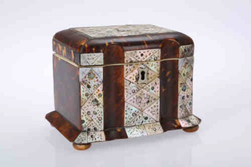 An early Victorian tortoiseshell and mother of pearl tea caddy, the hinged rectangular lid with double fluted front, centred by a panel of mother of pearl lozenges, each flower engraved lozenge with abalone inlaid detail, applied to the centre with a whit