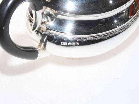 Silver four piece tea set of oval form, Ernest Viner, Sheffield 1966, 55 troy oz gross. thumbnail