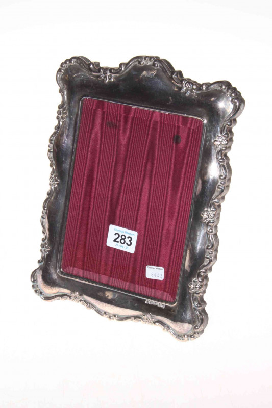 Silver framed bevelled glass easel photograph frame, 27cm by 19.5cm, modern.