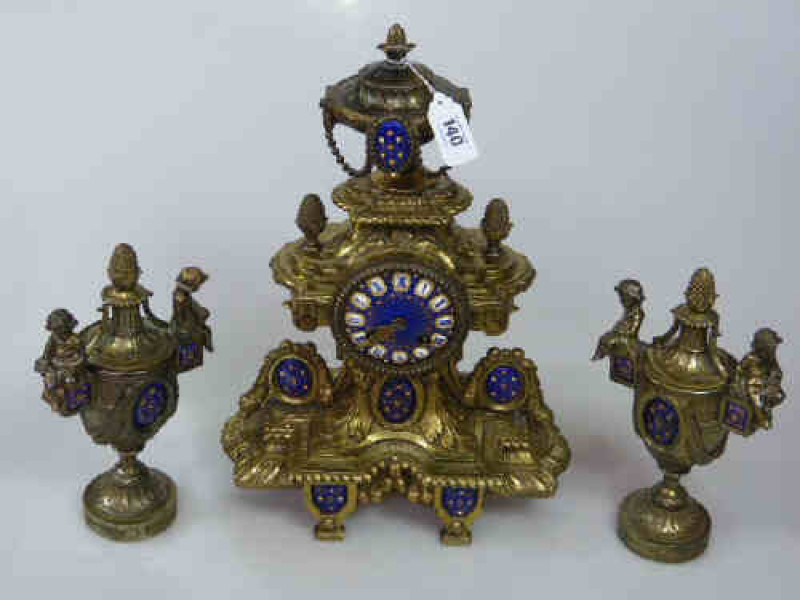 A Gilt Metal Clock Garniture