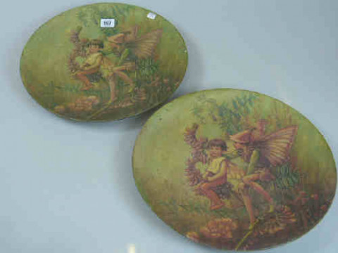 Pair of Pottery Plaques decorated with Pixies and Floral Scenes