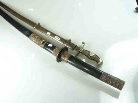 Japanese Katana and a 19th Century Sabre with associated scabbard, unmarked...
