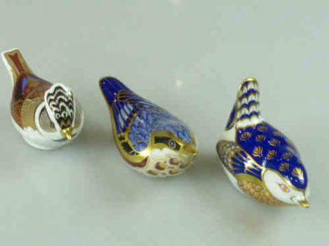 Three Royal Crown Derby Paperweights, each with gold stopper